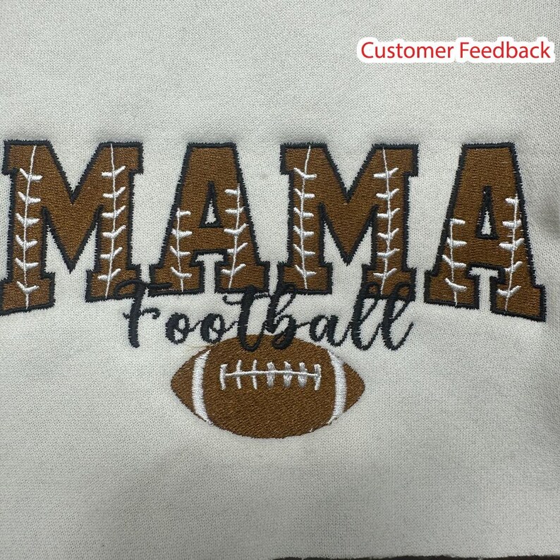 May include: Brown embroidered sweatshirt with the text "MAMA Football" and a brown football graphic.