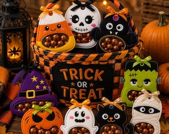 May include: A woven orange and black basket with the text TRICK OR TREAT, filled with felt Halloween ornaments including a candy corn, skull, bat, witch hat, pumpkin, ghost, black cat, Frankenstein monster, and mummy, each holding small round candies.