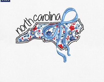 May include: Embroidered design featuring the outline of North Carolina filled with a floral pattern in red and blue. A blue ribbon is tied over the state. The text "north carolina" is above the state outline. Available sizes are 4", 5", 6", and 8".