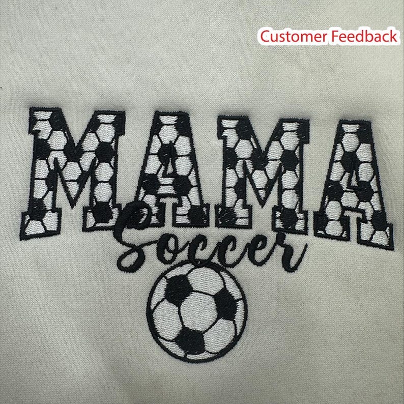 May include: White sweatshirt with black embroidery that says "MAMA Soccer" with a soccer ball design.