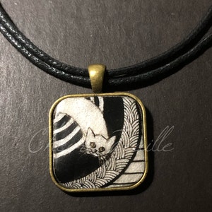 Cat Jewelry: A White Cat with Gold Eyes is on the Rug. Brass Bezel Pendant. Original Ink Drawing on Polymer Clay. Black White Gold 5438