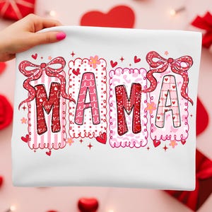 May include: White fabric with the word "MAMA" in red and pink letters. Each letter is decorated with patterns like stripes, hearts, and bows. The design includes hearts and floral accents, perfect for Valentine's Day.