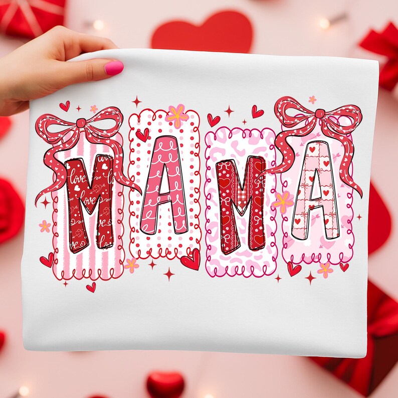 May include: White fabric with the word "MAMA" in red and pink letters. Each letter is decorated with patterns like stripes, hearts, and bows. The design includes hearts and floral accents, perfect for Valentine's Day.