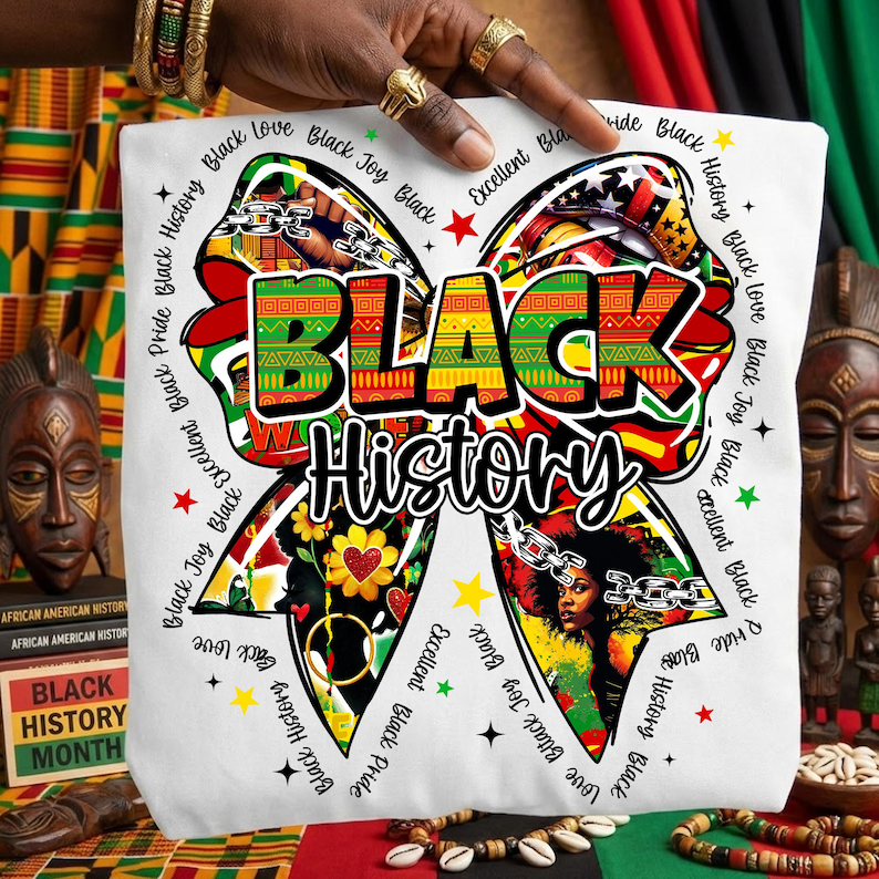 May include: White tote bag featuring a colorful bow design with the words "BLACK History" in bold letters. The bow is decorated with various patterns, including a portrait of a woman, flowers, and chains. The words "Black Joy," "Black Love," and "Black Pride" are also included.