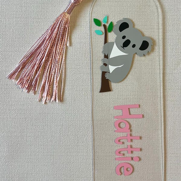 Koala themed bookmark, personalised with a name. Great for children or adults who love reading and koalas/animals. Acrylic with pink tassel.