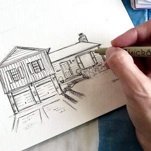 May include: A black and white line drawing of a house with a garage and a driveway. The drawing is on a white piece of paper.