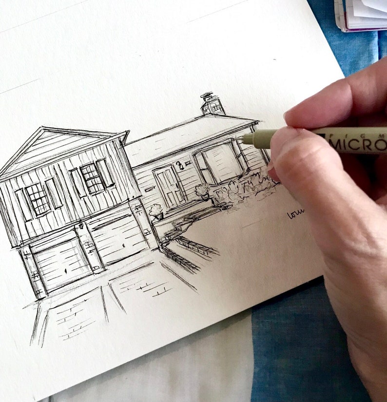 May include: A black and white line drawing of a house with a garage and a driveway. The drawing is on a white piece of paper.