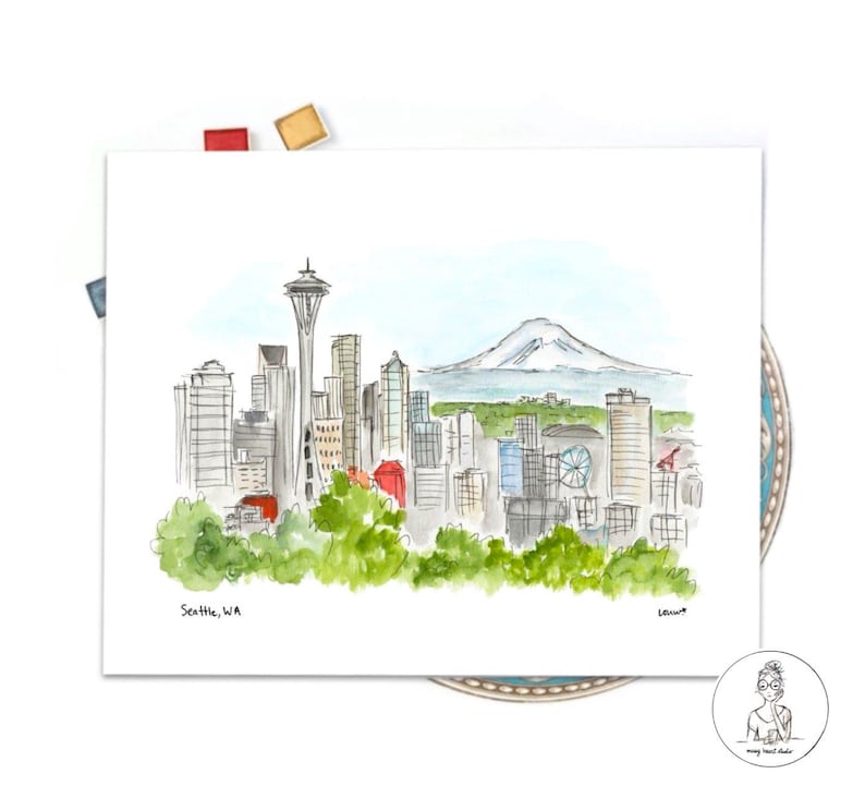 May include: Watercolor painting of the Seattle skyline with the Space Needle and Mount Rainier in the background. The painting is on a white background with the text "Seattle, WA" in the bottom left corner.