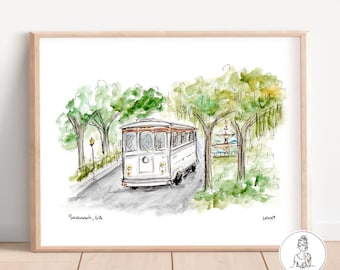 May include: Watercolor illustration of a white trolley with a brown roof driving down a street lined with trees. The text "Savannah, GA" is written in the bottom left corner of the image.