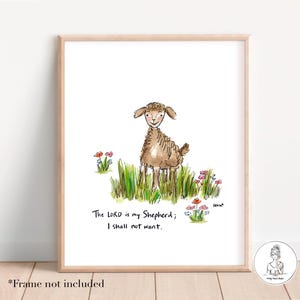 May include: Watercolor print featuring a brown sheep standing in green grass with colorful flowers. The text "The LORD is my Shepherd; I shall not want" is written below the sheep. The artwork is framed in a light wood frame.
