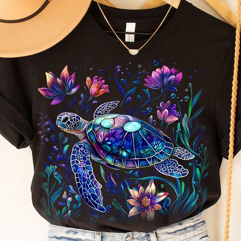 a woman's t - shirt with a turtle on it