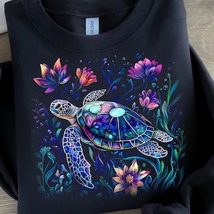 a t - shirt with a turtle and flowers on it