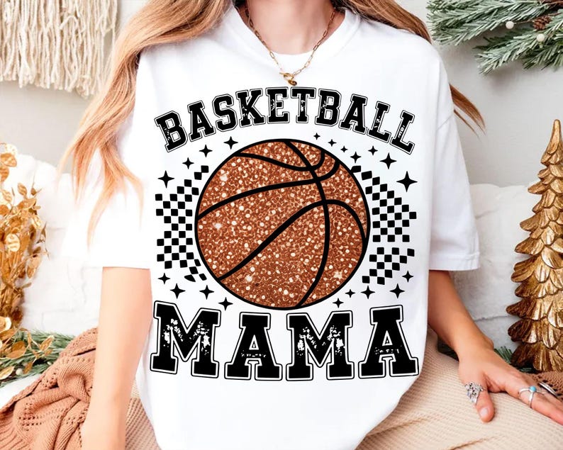 A person wearing a white t-shirt with a basketball graphic and the text "BASKETBALL MAMA" printed on it.