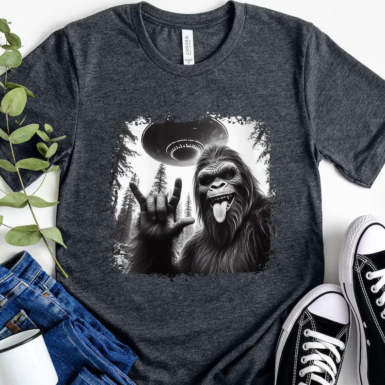 a black and white photo of a gorilla holding a frisbee