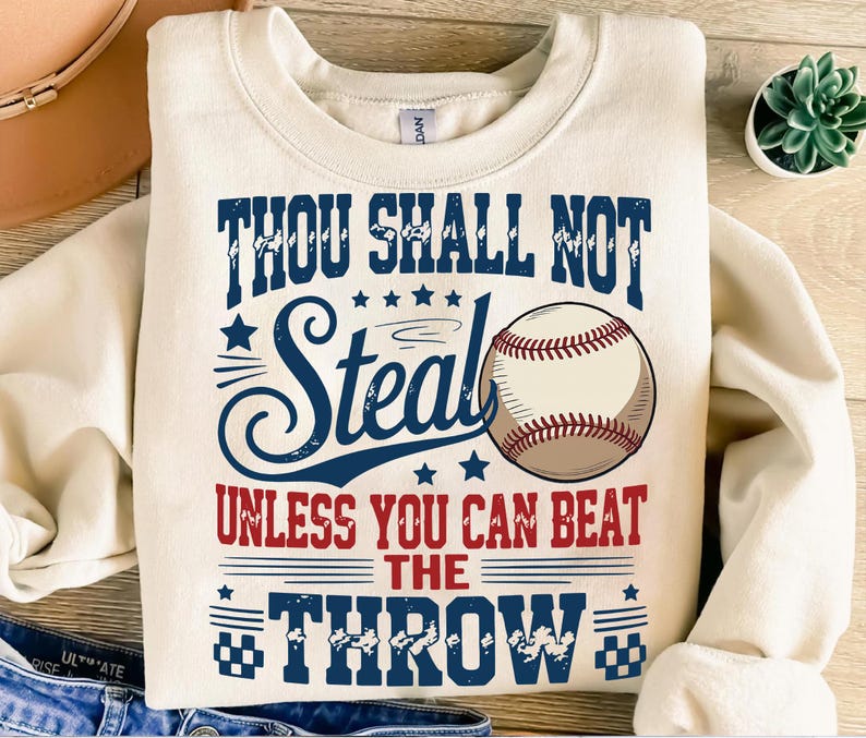 A white sweatshirt with a humorous baseball-themed design and text printed on it.