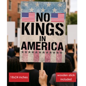 May include: A protest sign with the text "NO KINGS IN AMERICA" in large black letters. The sign features the American flag and is 18x24 inches. A wooden stick is included.