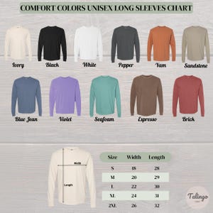 May include: A chart displaying Comfort Colors unisex long sleeve shirts in various colors, including ivory, black, white, and blue jean. The chart also shows size measurements: width and length in inches for sizes S, M, L, XL, and 2XL.