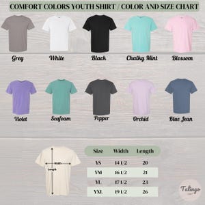May include: A color and size chart for Comfort Colors youth shirts. The chart displays various shirt colors, including grey, white, black, and mint. Size measurements are provided in inches for youth sizes, with widths ranging from 14 1/2 to 19 1/2 inches and lengths from 20 to 26 inches.