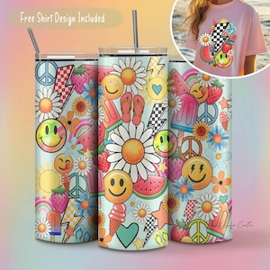 Puede incluir: Un vaso colorido con un dise&ntilde;o que presenta caras sonrientes, flores, sand&iacute;a, helado y signos de paz. El vaso es azul y blanco con una variedad de colores brillantes. "Free Shirt Design Included" est&aacute; escrito en la parte superior de la imagen.
