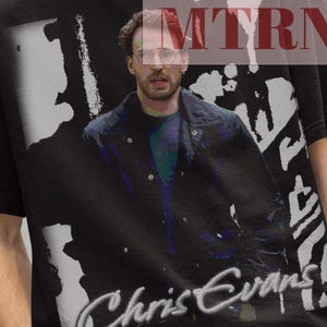 May include: Black t-shirt with a white and gray graphic of Chris Evans. The graphic includes a black and white image of Chris Evans and the text "Chris Evans".