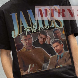 May include: Black t-shirt featuring a vintage-style graphic of a band called "James Theo". The graphic depicts four men in a band setting. The t-shirt has a crew neck and short sleeves.