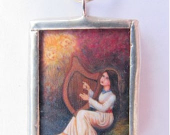 Saint Cecilia Plays the Harp Glass and Solder Medal
