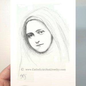 May include: A black and white pencil drawing of a woman with long hair, wearing a veil. The drawing is on a white background with the text "www.CatholicArtAndJewelry.com" at the bottom.