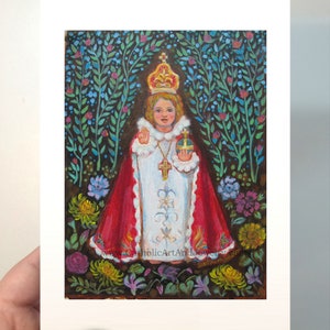 May include: A painting of a young child dressed in white and red robes, wearing a crown and holding a golden orb. The child is surrounded by a lush green garden with colorful flowers.