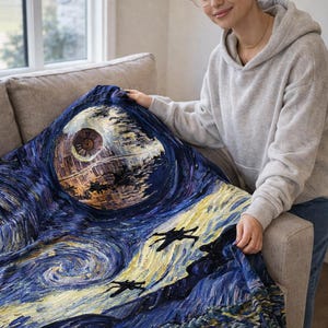 May include: A blue blanket featuring a stylized depiction of the Death Star and X-wing fighters against a swirling night sky, reminiscent of Van Gogh's "Starry Night." The blanket is a blend of dark blues, yellows, and browns.