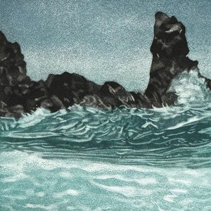 May include: A black and white print of a rocky coastline with crashing waves. The waves are a light blue and green color. The rocks are dark and jagged.