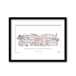 May include: A framed black and white line drawing of the University of South Carolina campus, with red accents. The text "university of south carolina columbia sc" is below the drawing.