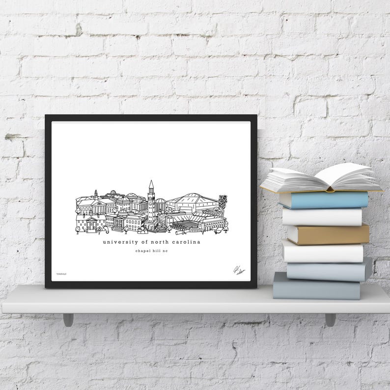 May include: Black and white line art print of the University of North Carolina campus, including the iconic bell tower and the Dean E. Smith Center. The text "university of north carolina" and "chapel hill nc" is printed below the image.