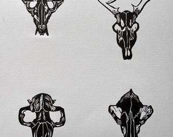 Original Linocut “Wildlife Skulls” print on 8.5x11” Block Print Paper
