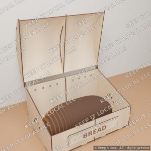 May include: A light-colored wooden bread box with an open hinged lid. The box features a rectangular front panel with the word BREAD engraved in brown letters. Inside the box sits a single brown loaf of bread with visible horizontal ridges.