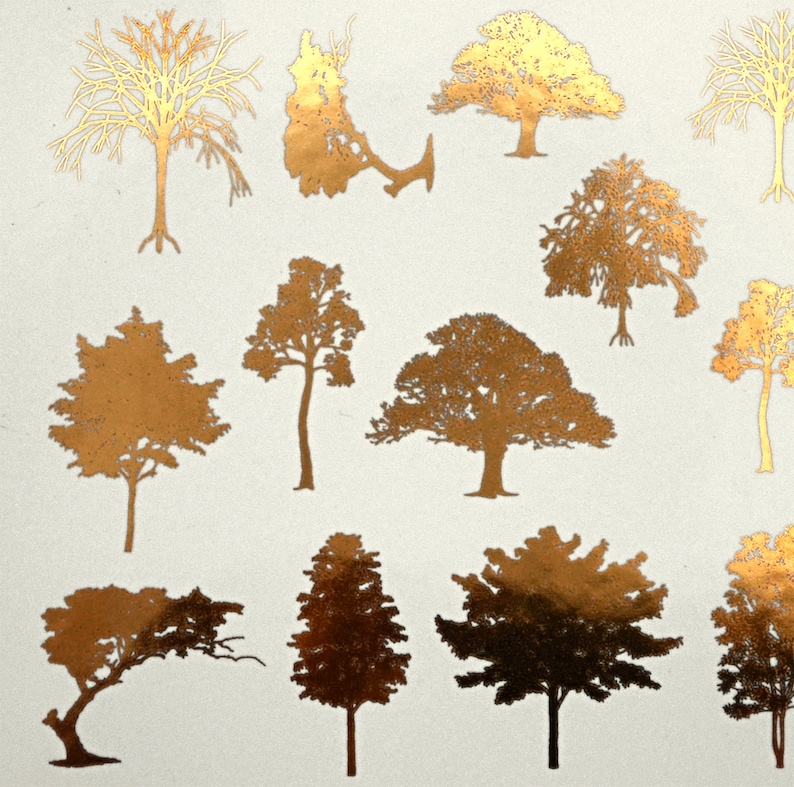 May include: A sheet of gold foil stickers featuring various tree silhouettes. The trees are in different styles and sizes, with some having bare branches and others having full foliage.