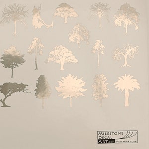 May include: A sheet of gold foil decal stickers featuring various tree silhouettes. The stickers are perfect for adding a touch of nature to any project.