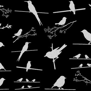 May include: Silhouette of various birds perched on branches against a black background. The birds are white and appear to be in flight or resting.