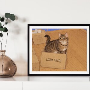 May include: A tabby cat sits inside a cardboard box with the words "Little Fatty" written on the side. The cat is looking directly at the viewer. The box is sitting on a wooden floor.