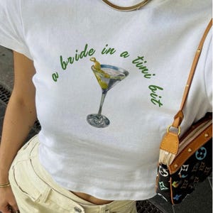 A Bride In A Tini Bit 90&#39;s Style Baby Tee, Bride To Be Shirt, Dirty Martini Themed, Filthy Martini, Martini Bachelorette Party CropTop, Y2K