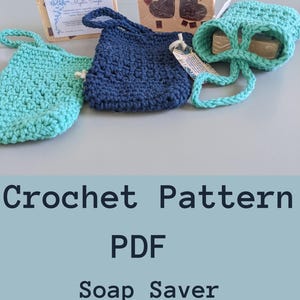 May include: Crochet pattern PDF for a soap saver. The image shows three crocheted soap savers in blue, green, and teal. The savers have a loop for hanging.