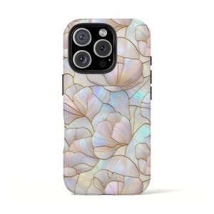 May include: A smartphone case with a floral design. The case features a pattern of white, iridescent flower shapes outlined in gold. The case has a glossy finish and a camera cutout.
