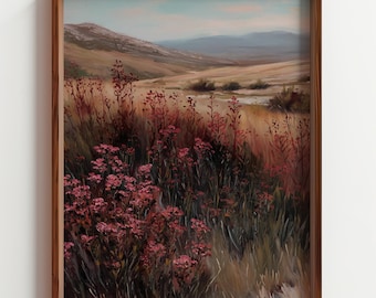 Puede incluir: Pintura de paisaje enmarcada que presenta un campo de flores rojas en primer plano, colinas onduladas y un cielo azul pálido. La obra de arte está encerrada en un marco de madera marrón oscuro, agregando un toque clásico a la escena pastoral.