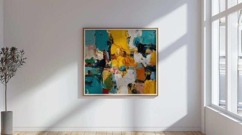 May include: Abstract oil painting with a gold frame. The artwork features a vibrant mix of colors, including teal, yellow, white, orange, and black. The painting is displayed on a white wall in a room with a window and a potted plant.