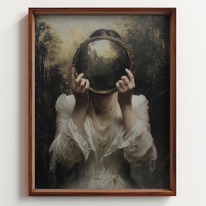 May include: A framed artwork featuring a woman in a white dress holding a round mirror. The mirror obscures her face, reflecting a landscape. The artwork is set against a dark, blurred background, and the frame is a warm brown.