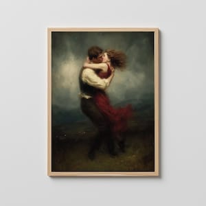 May include: A framed print of a romantic painting. The artwork depicts a couple embracing and kissing. The woman wears a flowing red dress, and the man is in a white shirt and dark vest. The background features a cloudy sky and a landscape.