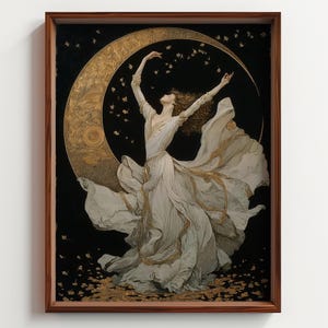 May include: A framed art print depicting a woman in a flowing white gown dancing before a golden crescent moon. The artwork has a dark background with gold accents and a wooden frame.