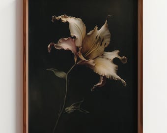 May include: A framed floral print featuring a detailed depiction of a lily. The flower has creamy white and pale pink petals with brown spots, set against a dark background. The frame is made of dark brown wood, adding a classic touch.