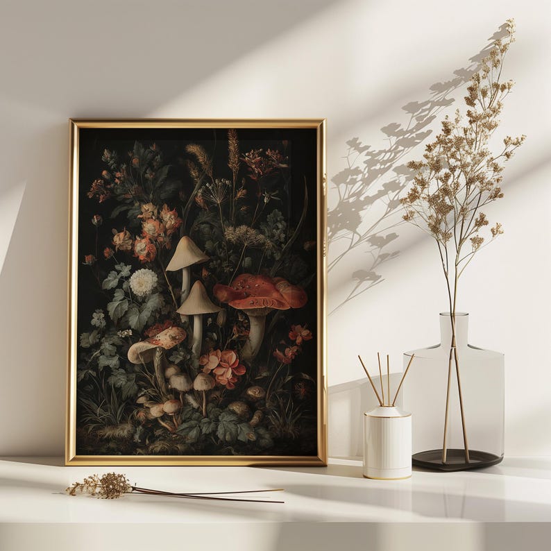 May include: A framed botanical print with a dark backdrop, showcasing mushrooms, flowers, and foliage in red, orange, and green hues. The gold frame enhances the artwork. The print is displayed on a white surface.