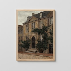 May include: A framed print of a classical building with a stone facade, arched doorway, and multiple windows. The building is adorned with climbing greenery and has a dark roof. The artwork is set against a neutral background.