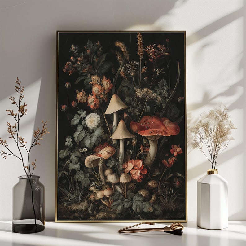 May include: A framed botanical print depicting a dark scene with mushrooms and flowers. The mushrooms have tan caps and red spots. The flowers are in shades of orange, pink, and white. The print is in a gold frame.